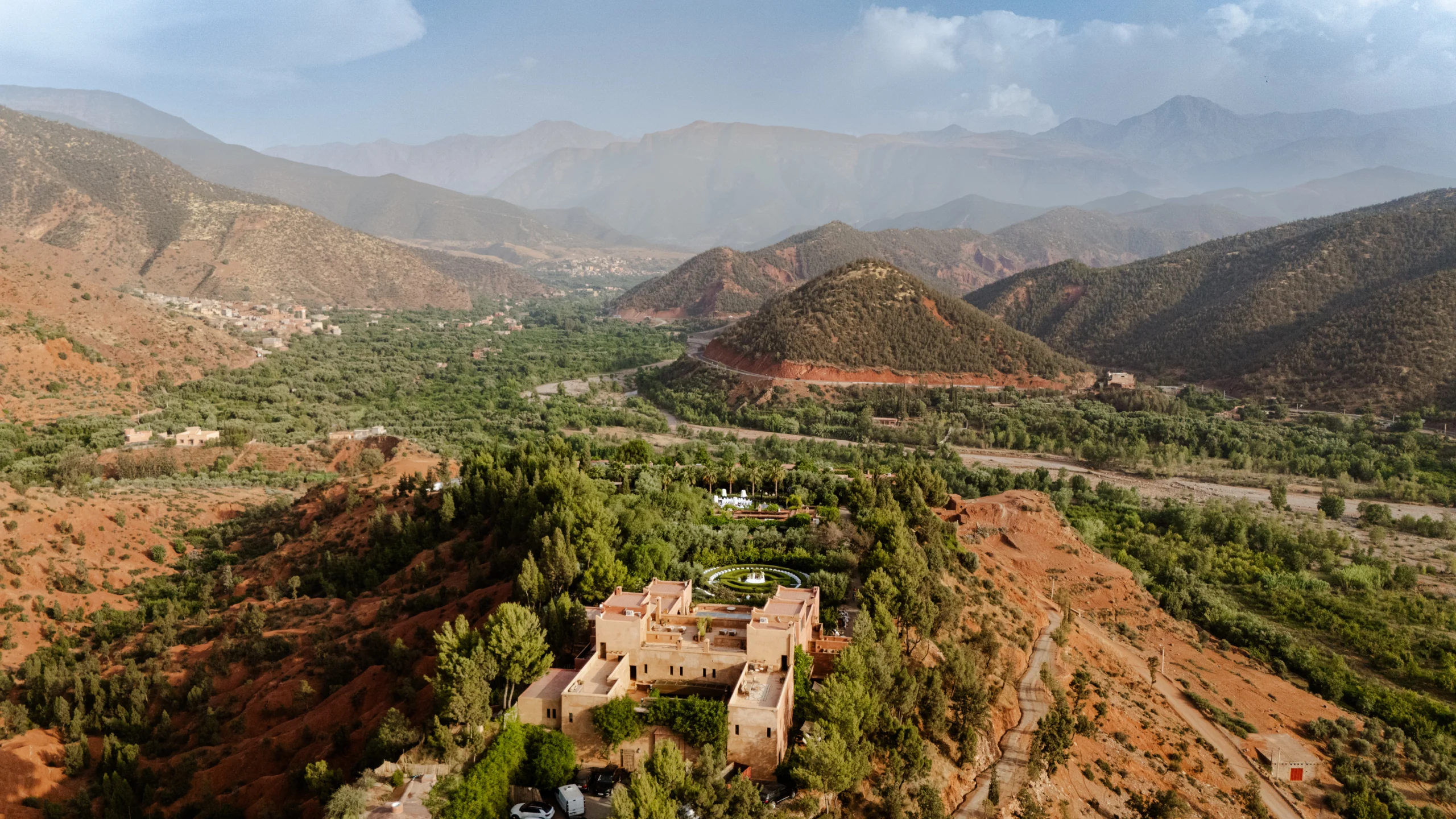 a building surrounded by mountains